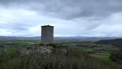 castle-tower-"da-pena"-located-in-xinzo-de-limia,-ourense,-spain,-aerial-rise-reveal