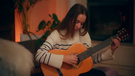 Woman-Playing-Guitar-Writing-Song-Composing-Music