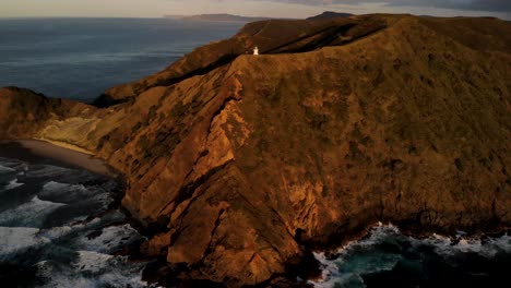 Bird's-Eye-View-Of-Cape-Reinga-Lighthouse-At-Dusk-In-Northland,-North-Island-Of-New-Zealand