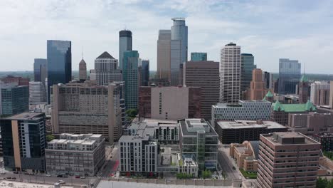 Rising-close-up-aerial-shot-of-the-Minneapolis-skyline-in-Minnesota