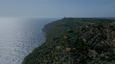 Aerial---Forward-drone-shot-along-Dingli-cliff-to-chapel-on-sunny-day