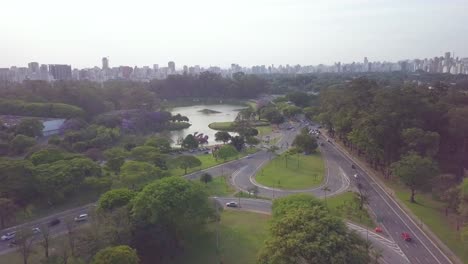 Panning-aerial-shot-of-Ibirapuera-park-and-center-of-Sao-Paolo-near-Avenida-Paulista-in-Brazil