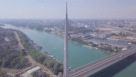Breathtaking-4k-aerial-orbiting-establishing-shot-of-Sava-river-and-Ada-bridge-in-Belgrade