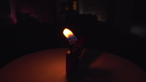 Burning-Original-Zippo-lighter-in-a-dark-environment-with-wind