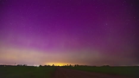 Northern-lights-or-aurora-borealis-above-the-horizon---time-lapse