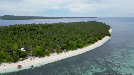 Aerial-pullback-of-balabac-island-reef-along-white-sandy-beach-shoreline