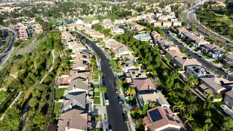 Aerial-Flying-Over-Santa-Clarita-Suburban-Housing-Neighborhood-On-Sunny-Afternoon