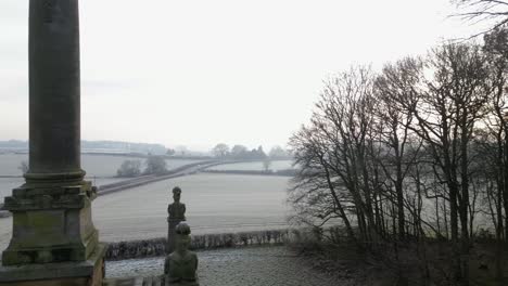 Frozen-fields-and-countryside-passing-the-monument-at-Caste-Howard-on-frosty-winter-day