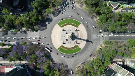 drone-shot-of-ascent-in-the-angel-of-independence-in-the-avenue-paseo-de-la-reforma