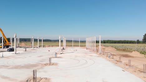 The-construction-of-a-hall-with-concrete-columns-on-foundations-is-underway
