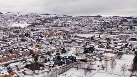 City-Gjovik-in-Norway-on-winter-day-in-a-drone-pull-in-shot