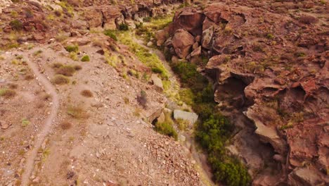 Dry-riverbed-valley-in-Tenerife-desert-landscape,-aerial-drone-view