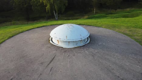 Aerial-shoot-from-drone,-flying-around-a-WWI-bunker-turret-at-Verdun,-France