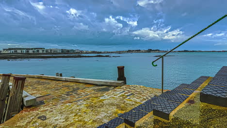 Rising-ocean-tide-on-a-boat-ramp-with-stairs