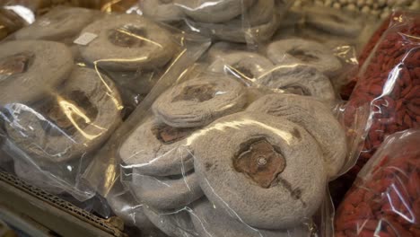 dried-Persimmon-cake-in-plastic-bag-for-sale-at-Asian-street-food-market-documentary