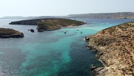 Drone-view-of-Blue-Lagoon,-Comino-island,-Malta,-Europe