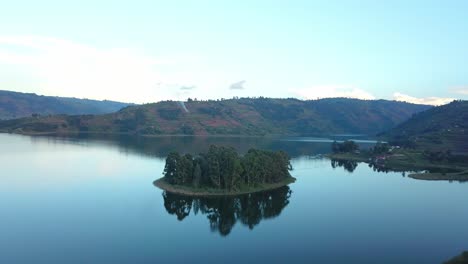 Isolated-Islet-With-Mirror-Reflection-On-Lake-Bunyonyi-In-South-western-Uganda,-Africa