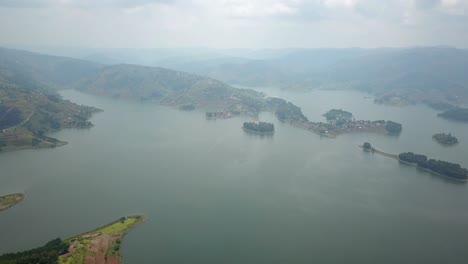 Panoramic-View-Of-Lake-Bunyonyi-On-A-Misty-Day-In-Uganda,-Africa---drone-shot