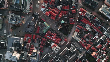 Top-fixed-and-slowly-descending-aerial-view-over-colorful-rooftops-of-Bergen,-Norway