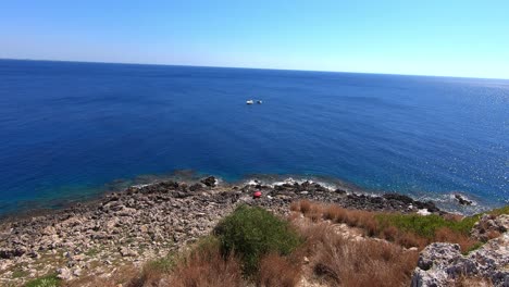 Panoramic-view-of-the-Ionian-sea,-from-cliffs-on-a-sunny-day