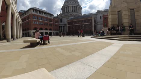 Time-Lapse-of-people-moving-around-Paternoster-Square-in-London,-St-Pauls-can-be-seen-in-the-background