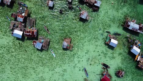Birds-Eye-View-of-the-beautiful-water-village-of-the-Bajau-Laut-Sea-Nomads-in-Pulau-Omadal,-Sabah,-Malaysia