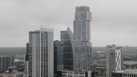 Close-up-view-of-buildings-in-downtown-Austin,-Texas-with-drone-parallax-spinning