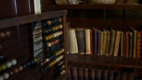 Abacus-and-old-books-in-victorian-school-classroom