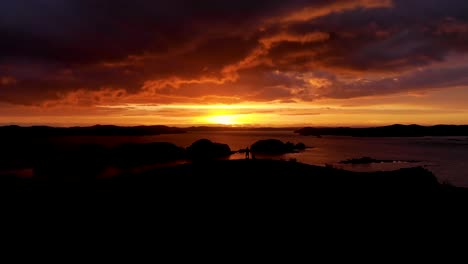 Dramatic-Fiery-Sunset-Sky-In-Poroporo-Island,-Bay-Of-Islands-Of-New-Zealand---aerial-drone-shot