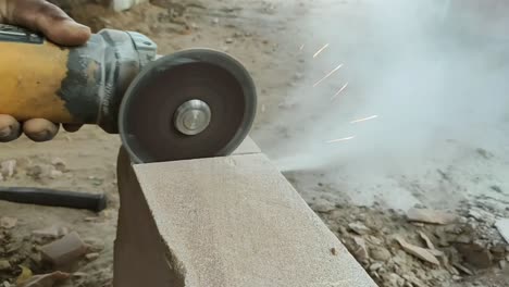 Stone-cutting-video-by-hand-holding-cutter-machine-2