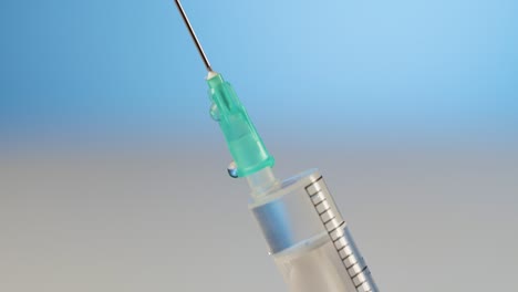 Close-up-medical-syringe,-let-the-air-out,-concept-of-vaccination-or-illness