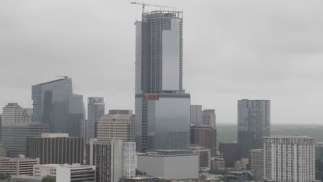 Close-up-of-buildings-in-downtown-Austin,-Texas-with-drone-video-parallax-view-going-in-and-down