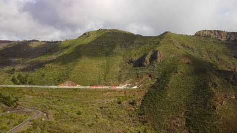 Highway-tunnel-through-mountain-in-Tenerife-island,-aerial-drone-view