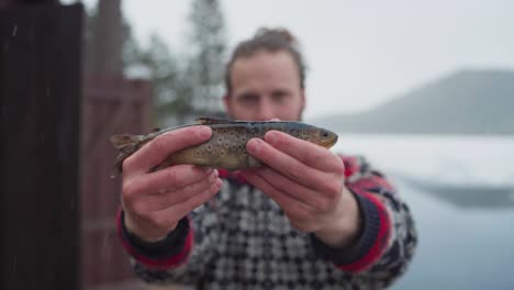 Rainbow-Trout-Fish-Holding-By-A-Fisherman-During-Ice-Winter-Fishing
