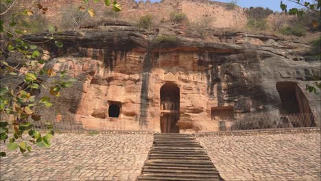 Ancient-Jain-sculptures-and-caves-carved-out-of-rocks-at-Gopachal-Parwat-of-Gwalior-Fort,-Madhya-Pradesh-,-India
