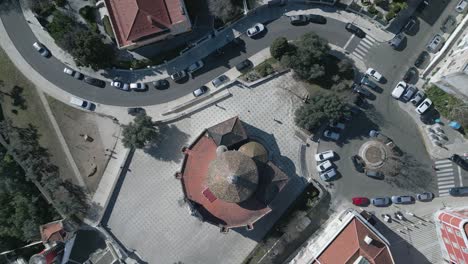 aerial-view-of-a-circular-building-with-a-red-roof-in-an-urban-area-of-Lisbon