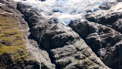 Impressive-nature-scenery,-aerial-view-of-glacier-melting-into-waterfalls