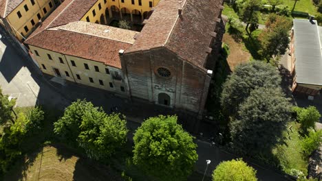 Top-View-Of-Chiesa-Santa-Maria-delle-Grazie-Church-In-Soncino,-Italy---drone-shot