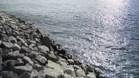 The-East-River's-mighty-waves-crash-against-a-concrete-retaining-wall-on-Brooklyn's-jetty