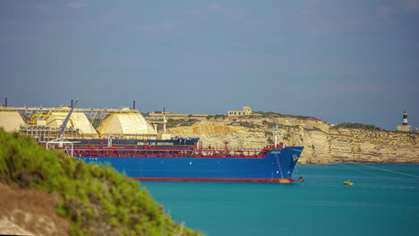 Huge-shipping-vessel-at-the-Malta-Freeport-harbor---time-lapse