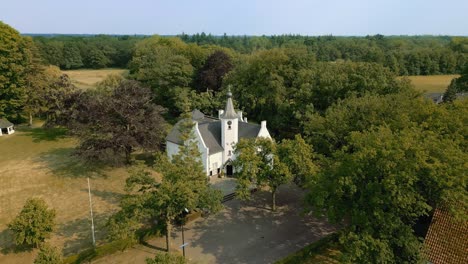 Castle-Cranendonck-in-Brabant-landscape-drone-with-farm,-forest,-field-moving-forward
