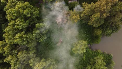 Top-Down-Footage-of-Smoke-Over-the-Amazon-River-and-Amazon-Rainforest,-Amazon-Fire