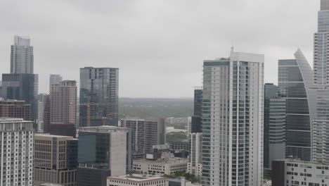 Close-up-view-of-buildings-in-downtown-Austin,-Texas-with-drone-parallax-left-to-right