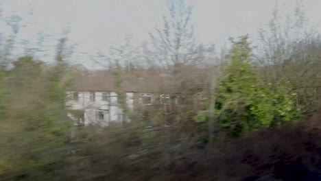 View-from-a-window-of-train-window-traveling-towards-Manchester,-UK