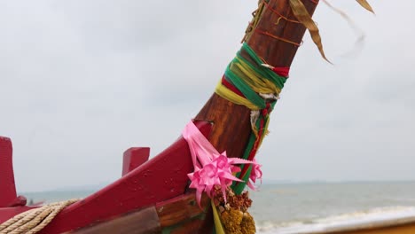 Flowers-and-colorful-ribbons-part-of-Buddhist-culture-asking-for-blessing-of-fishermen