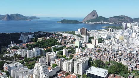 Sugar-loaf-landscape-at-Rio-de-Janeiro-aerial-shots-showing-buildings,-sea,-favela-on-a-sunny-day