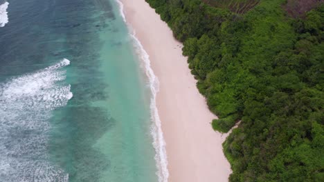 Reveal-shot-of-paradise-Mbawana-Beach-at-Sumba-island-during-day-time,-aerial