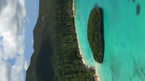 Sacred-Rock-islet-in-Kanumera-Bay-on-the-Isle-of-Pines---aerial-in-vertical-orientation