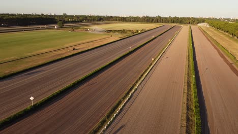 Aerial-flyover-Empty-Racecourse-of-San-Isidro-in-Buenos-Aires-during-golden-sunset