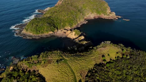 Walkaway-to-Tutukaka-Lighthouse,-New-Zealand-aerial-birds-eye-view